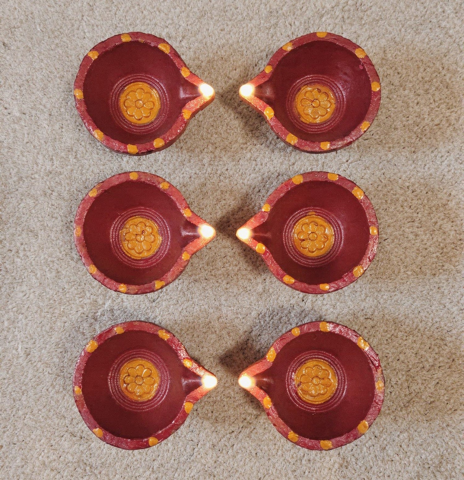 Beautiful small red-orange diyas for all perpus